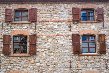 Fototapeta premium architecture of window frame and stone wall background
