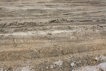 Wheel tracks on the soil.
