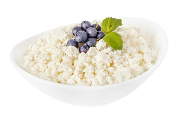 cottage cheese in a bowl with blueberries isolated on a white background - with clipping path - 115299759