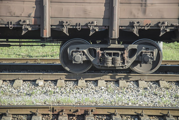 Naklejka premium Wheels of train on railway station