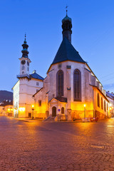Fototapeta premium Town hall and a church in the old town of Banska Stiavnica, Slovakia.