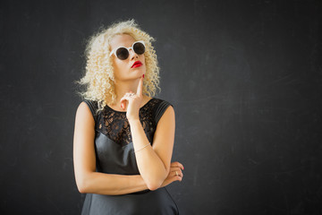 Fototapeta premium Woman in sunglasses being thoughtful