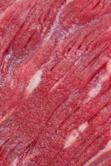 A piece of fresh marbled beef steak for cooking.