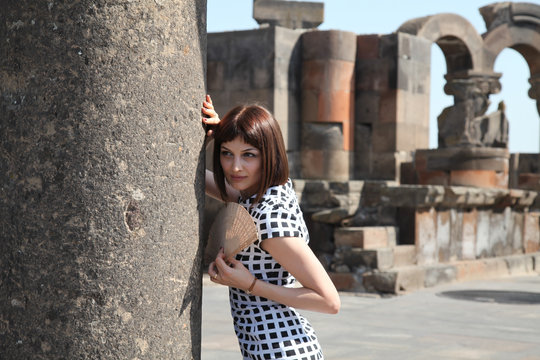 woman and old city ruins