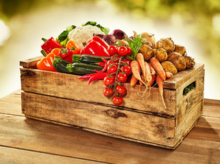 Wooden crate filled with farm fresh vegetables