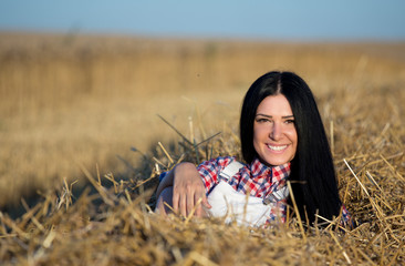 Girl lying in straw