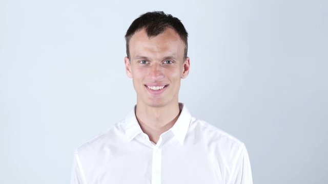 A man shows his hand hello