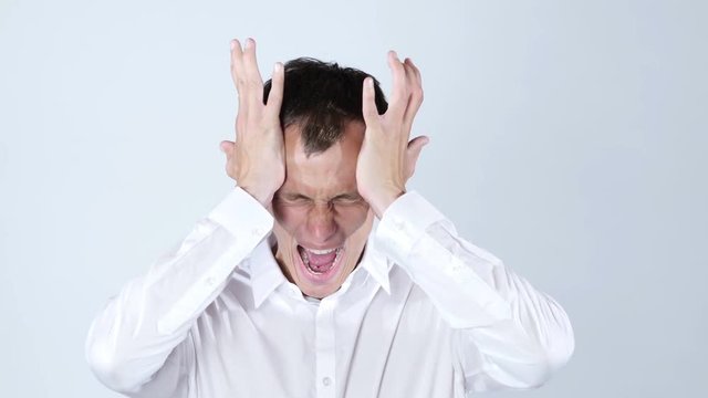 Man thinks very intensely having headache , stress