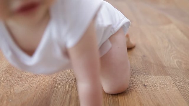 detail of a little baby crawling