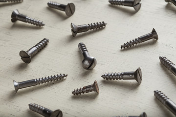 Accessory, assorted tools set on wooden light background. Construction assortment instruments for repairman, carpenter, builder. Copy space for text. Top view. 
