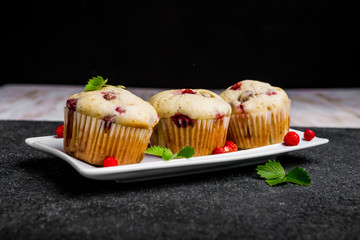 Homemade strawberry muffins in paper cupcake holder