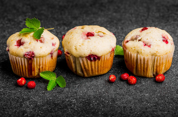 Homemade strawberry muffins in paper cupcake holder