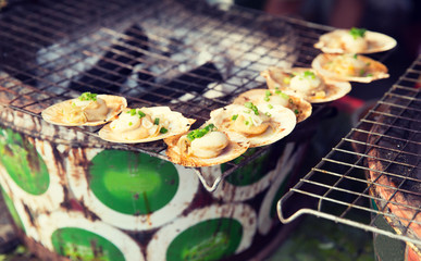 oysters or seafood grill at asian street market