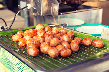 fried meatballs sale at street market