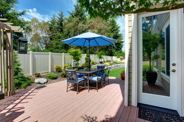 Fototapeta na wymiar House with backyard patio and landscape design