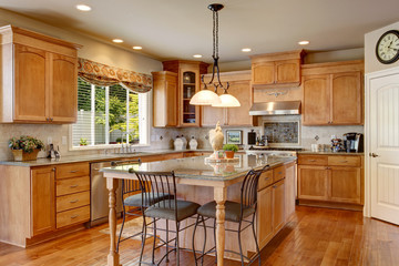 Classic American kitchen inerior with brown cabinets and granite counter top