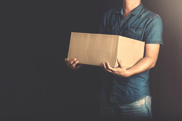man receiving a delivery from post at home