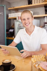 Waiter holding digital tablet