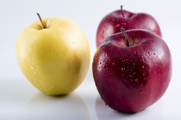 red apple with a yellow apple behind. Health and Nutrition