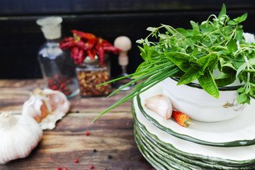 Italian cuisine - fresh italian herbs, garlic, dried red hot chili peppers