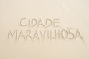 Cidade Maravilhosa (Portuguese for Marvellous City, the nickname of Rio de Janeiro, Brazil) message written in smooth sand on the beach