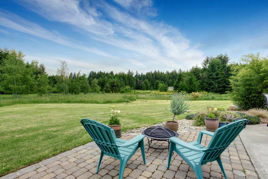 Beautiful House Backyard With Well Kept Lawn, Trees