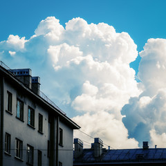 Blue sky with clouds over the  houses