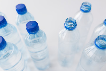 close up of bottles with drinking water on table