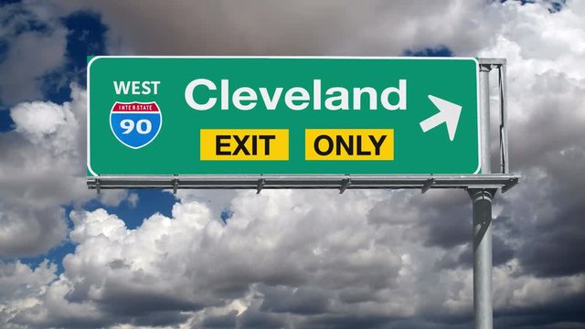Cleveland Ohio Interstate 90 exit only sign with time lapse clouds.