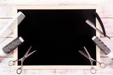 Blank blackboard and scissors hairdresser set with various acces - obrazy, fototapety, plakaty