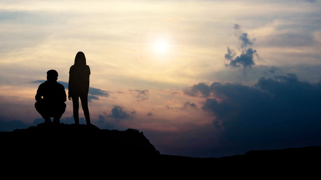 Silhouette Of Love Guy And Girl Against Sunset