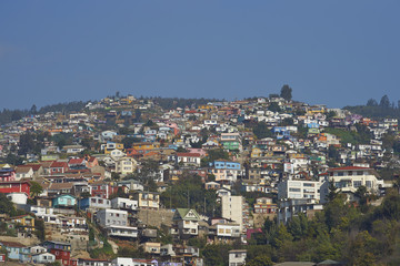 Colourfully decorated houses crowd the hillsides of the historic port city of Valparaiso in Chile.