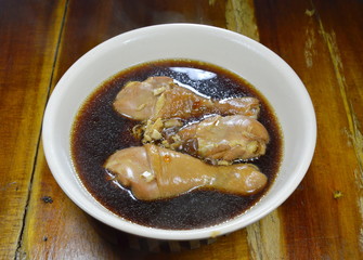 boiled chicken leg in fish sauce and Chinese herb brown soup