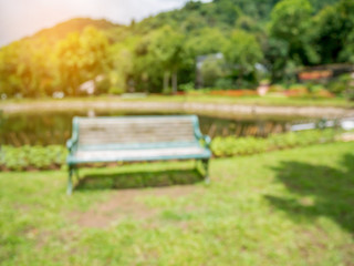 Fototapeta na wymiar blur bench in the park summer time natural background