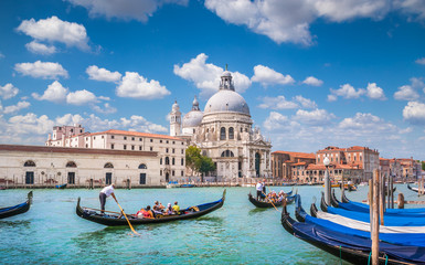 Fototapeta na wymiar Gondolas on Canal Grande with Basilica di Santa Maria della Salute, Venice, Italy