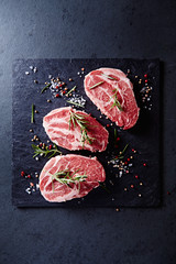 Fresh pork steaks with spices and rosemary