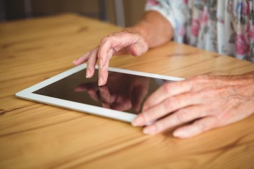 Fototapeta na wymiar Old person touching a digital tablet