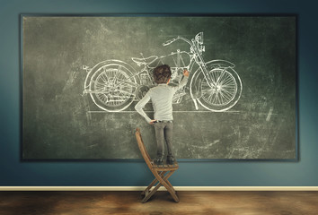 Young man with chalk draw a motorcycle