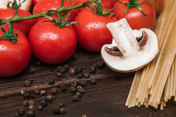 Fresh Italian food on wooden background.