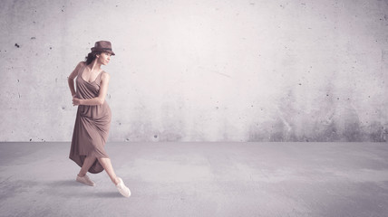 Pretty urban dancer with empty background