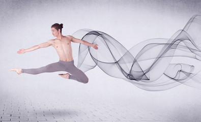 Fototapeta na wymiar Modern ballet dancer performing with abstract swirl