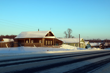 Village in a winter day and snow