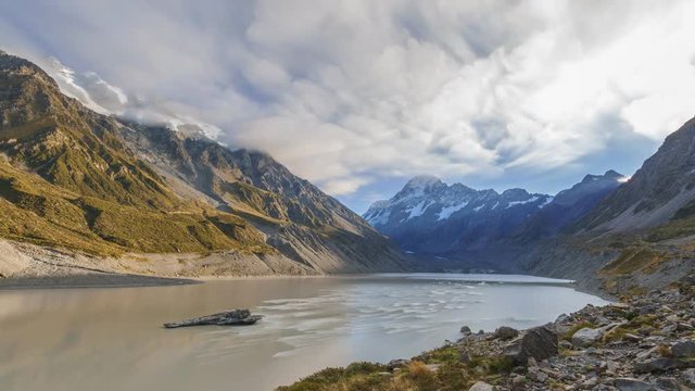 Spectacular View Of Hooker Glacier Terminal Lake And Aoraki Mount Cook At Mount Cook National Park, New Zealand. Time lapse stacked images creating beautiful short brush stroke effect on the clouds.