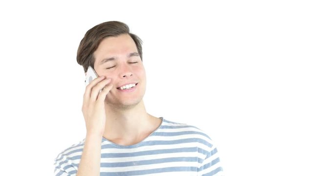Young man smiling and talking on smart phone