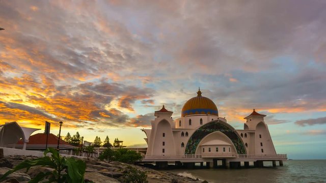 Beautiful Sunrise Over The Straits Mosque (Masjid Selat) at Malacca, Malaysia. One of Malacca's tourist attraction, the mosque was designed to appear floating above water during high tide. Zoom Out
