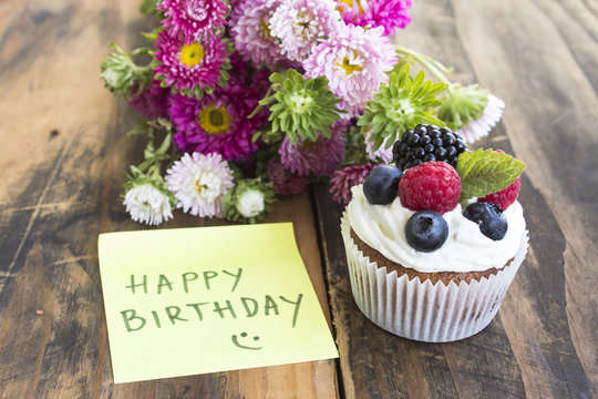 Delicious Cupcake with "Happy Birthday" Notepaper and Flowers