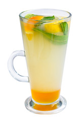 glass of cold fruit cocktail with ice, mint and pieces of fruit on a white background