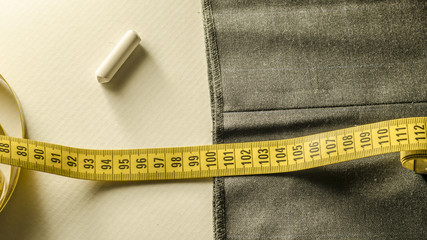 tailoring, still life with a tape measure a chalk and tissue