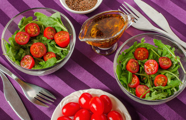 Breakfast for two with salad in salad bowls and Cutlery.