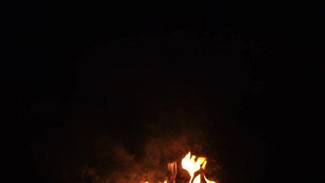 fire flames from campfire over black background